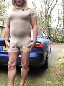 Kellycd2022, an amateur crossdresser, showcases her seductive MILF figure while urinating outdoors in a collection of 46 images on xHamster