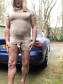 Kellycd2022, an amateur crossdresser, showcases her seductive MILF figure while urinating outdoors in a collection of 46 images on xHamster.