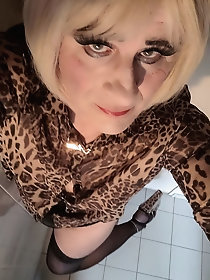 Flawless tranny GF is posing almost undressed on pix