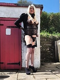 Summer dress with an opening at the top to give a glimpse of what is underneath.